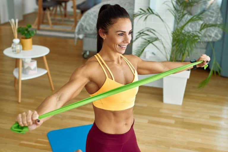 Featured image of a woman practicing with stretch bands