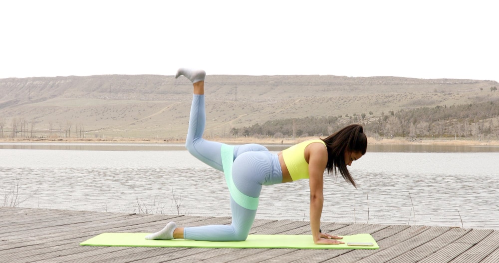 Image of a girl exercising with resistance bands