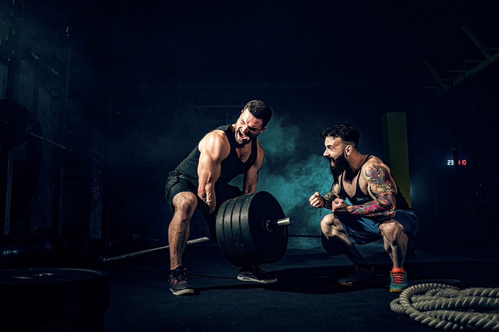 two men weightlifting with weightlifting gloves